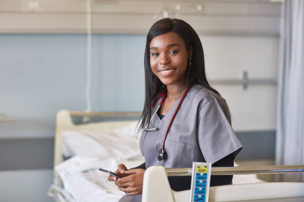 istock Medical student holding mobile phone in hospital 1083080090