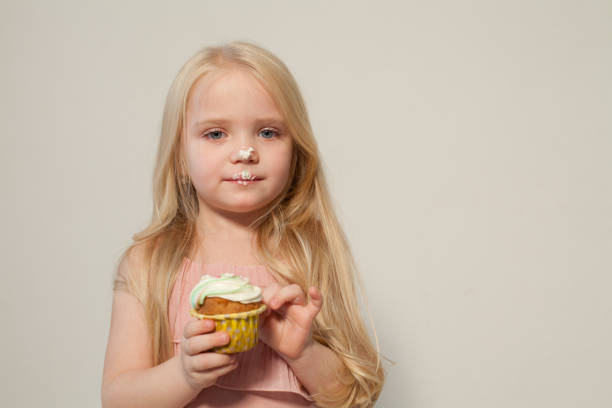 istock fashion girl eats a candy lollipop cake 1083081646