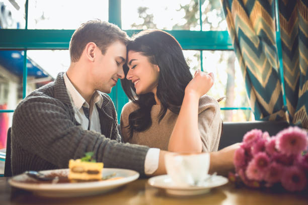 istock The cute couple sit in the restaurant 1083081994