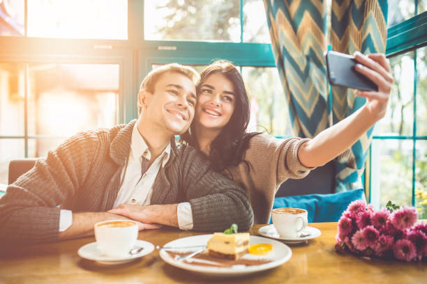 istock The happy couple making a selfie in a restaurant 1083082520