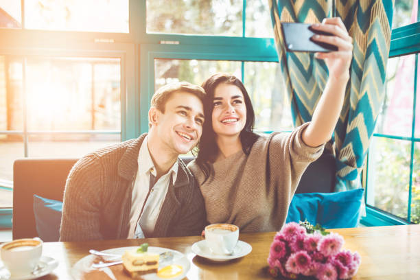 istock The happy couple making a selfie in a restaurant 1083082536