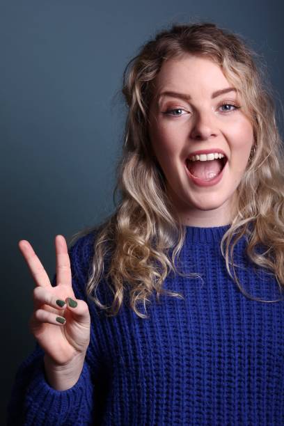 istock Caucasian woman in front of a colored background 1083082590