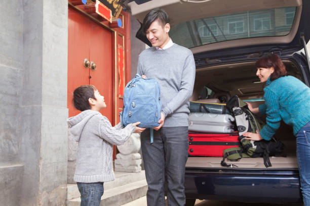 Chinese family packing car for trip