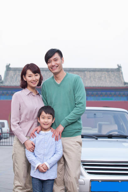 istock Chinese family smiling traveling 1083089266