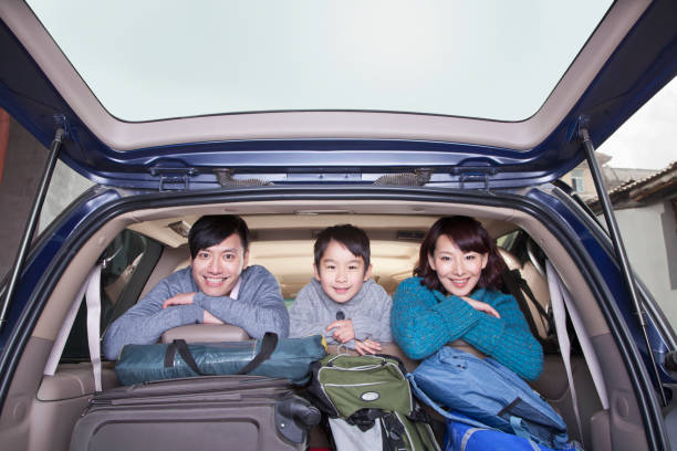 istock Chinese family in packed car 1083089340