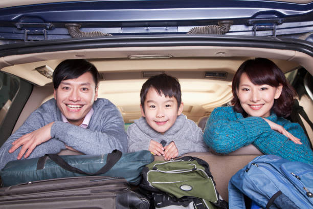 istock Chinese family in packed car 1083089408