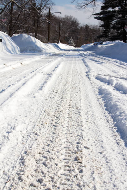 istock tire tracks on a snow covered road 1083091462