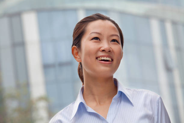 istock Cheering Chinese businesswoman 1083094034