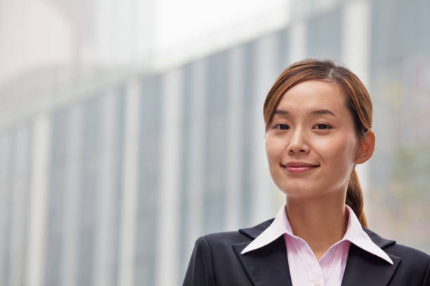 istock Smiling Chinese businesswoman looking at camera 1083094204