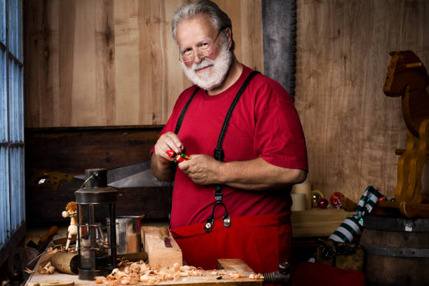 istock Busy Santa Claus Making Toys in Christmas Workshop, Copy Space 108309645