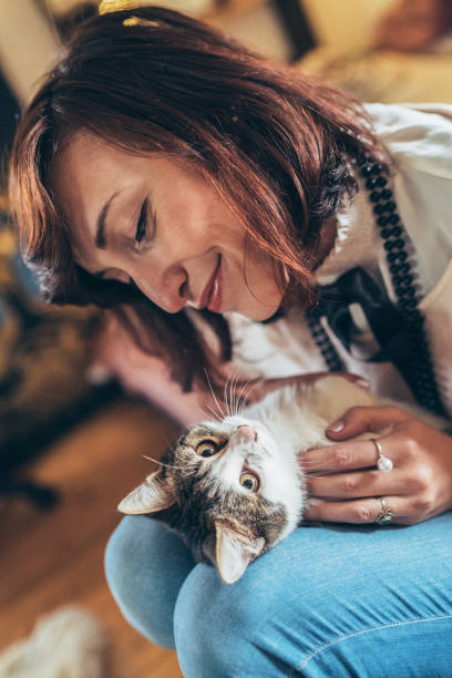 istock Woman and cat 1083098140