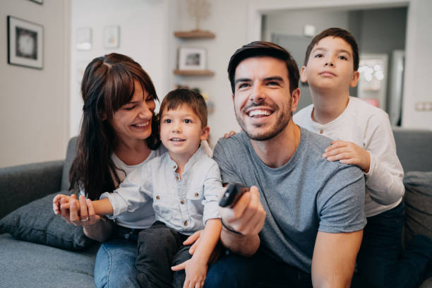 istock Family watching television 1083098154