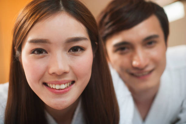 istock Smiling Chinese couple on bed 1083098626
