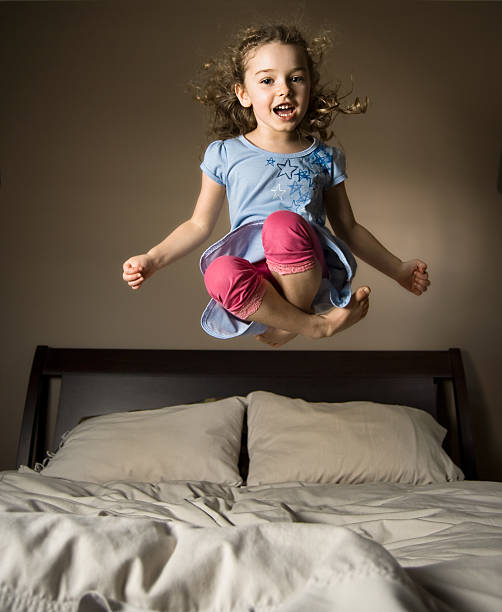 istock Young girl jumping on bed 108309901