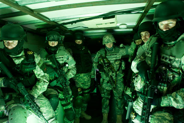 Special forces tactical unit preparing for raid stock photo