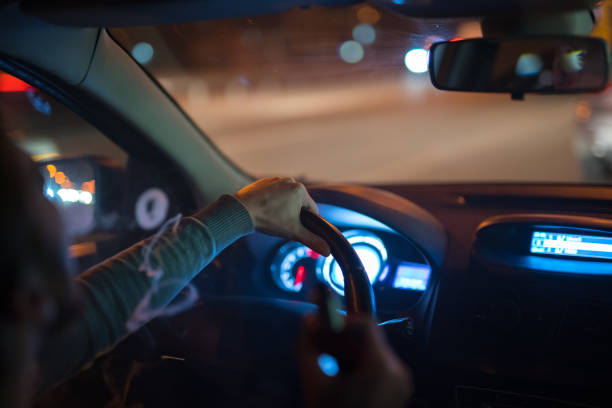 istock The man make a smoke rings in the car. Evening night time 1083100902
