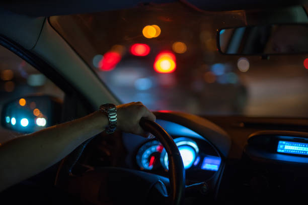 istock The man drive a car in the night time 1083100916