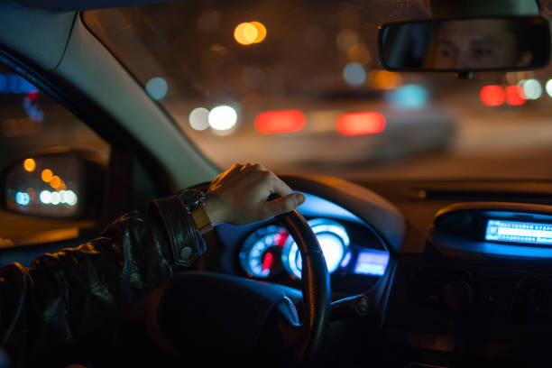 istock The man drive a car on the road. Evening night time 1083100930
