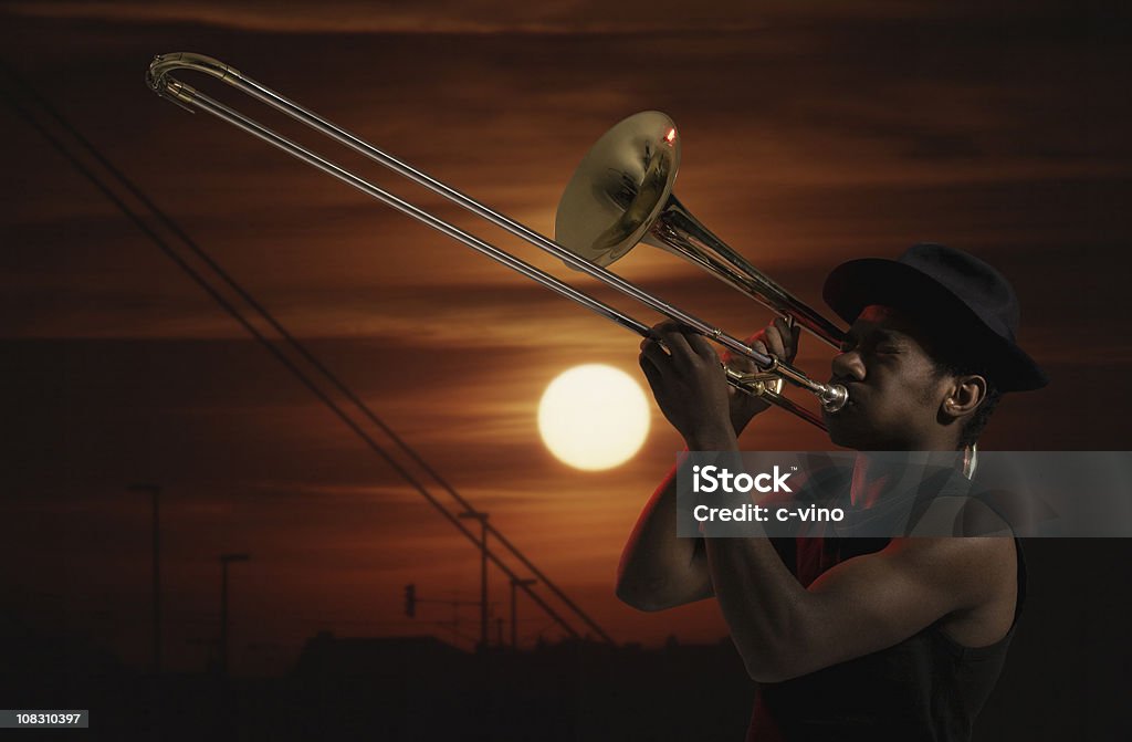 Trombonist at sunset  Trombone Stock Photo