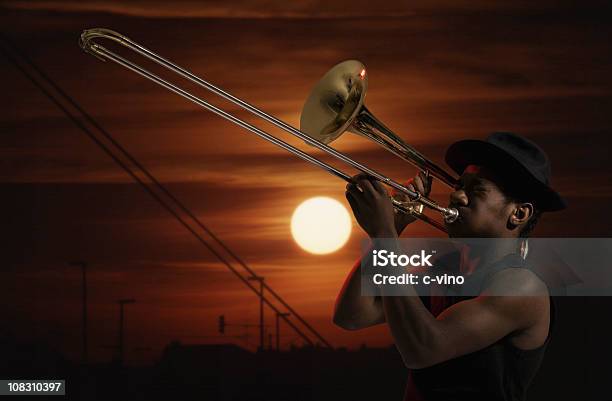 Trombonist At Sunset Stock Photo - Download Image Now - Trombone, African Ethnicity, Swing Dancing