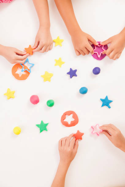 istock Hands playing with colorful clay 1083105150