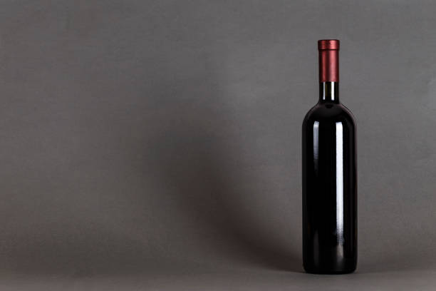 bottle of wine on a black background. - action alcohol alcoholism bar imagens e fotografias de stock