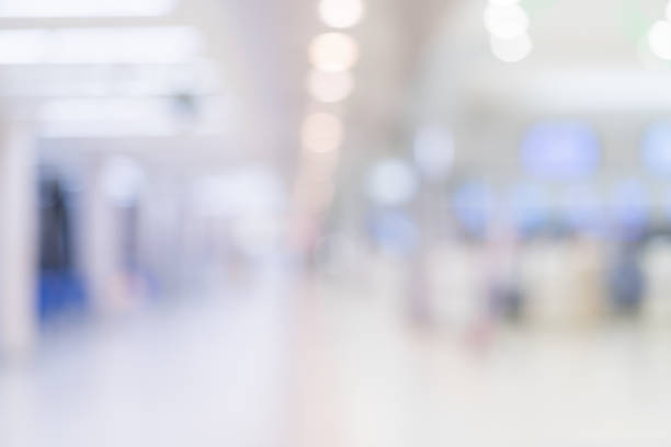 istock abstract blur image background of airport terminal corridor 1083107284