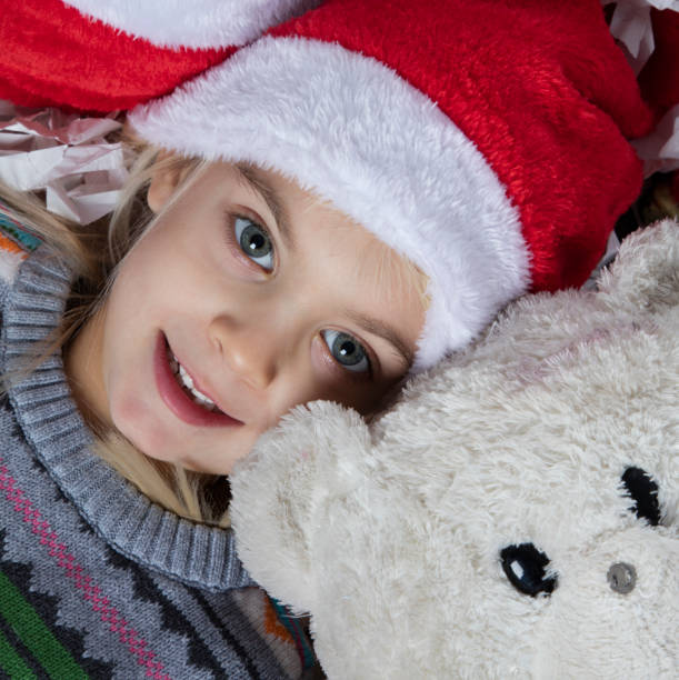 istock Girl Laying on Floor With Teddy Bear 1083107312