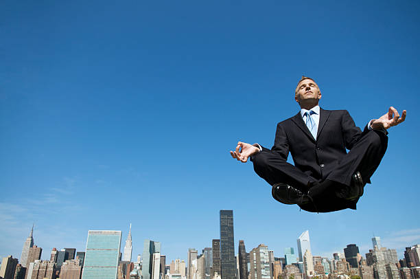 istock Powerful Meditating Businessman Levitating Above City Skyline 108310786