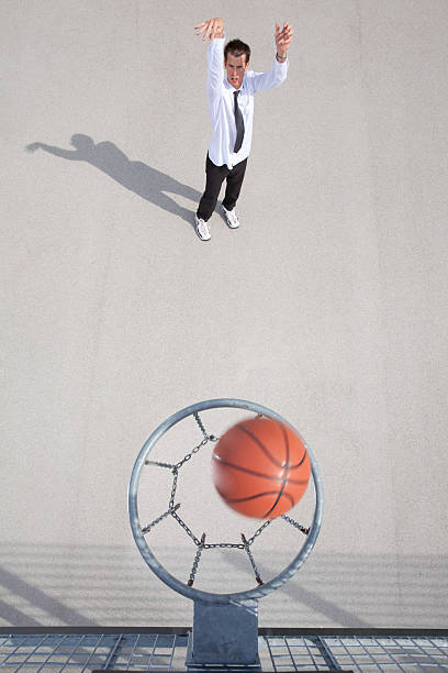 istock young businessman shooting some hoops 108310788