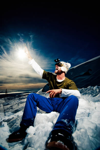 istock Young man sitting in the snow 108310807