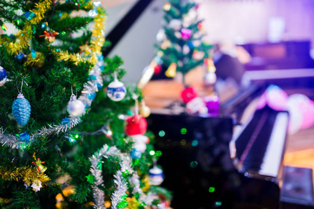 istock Piano and Christmas tree for christmas holiday background 1083108924