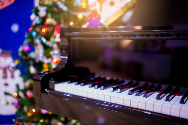 istock Piano and Christmas tree for christmas holiday background 1083109500
