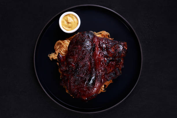istock roast pork knuckle with stewed cabbage and mustard 1083109546