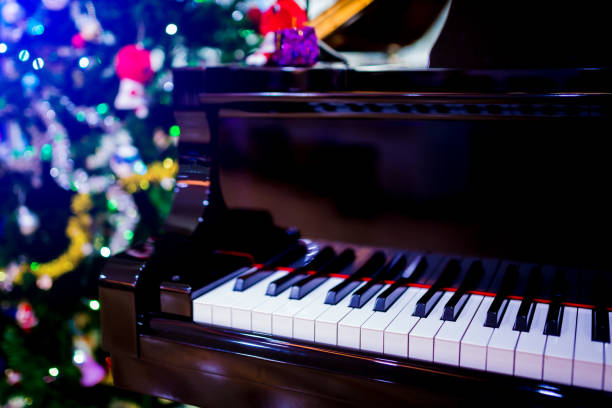 istock Piano and Christmas tree for christmas holiday background 1083109582