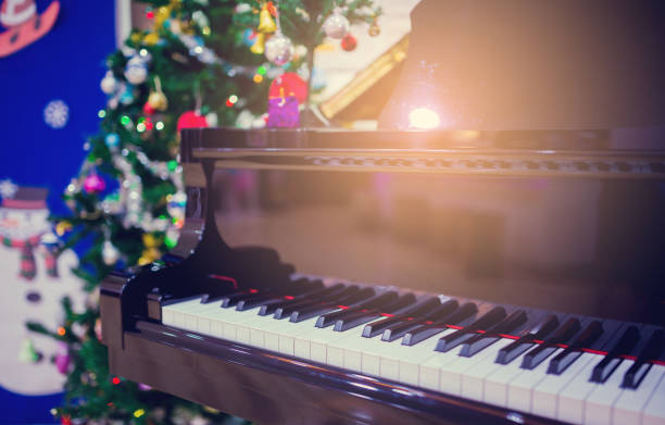 istock Piano and Christmas tree for christmas holiday background 1083109586