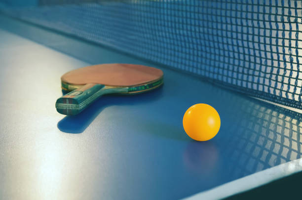 istock Tabletennis or ping pong racket and balls on table. 1083109682