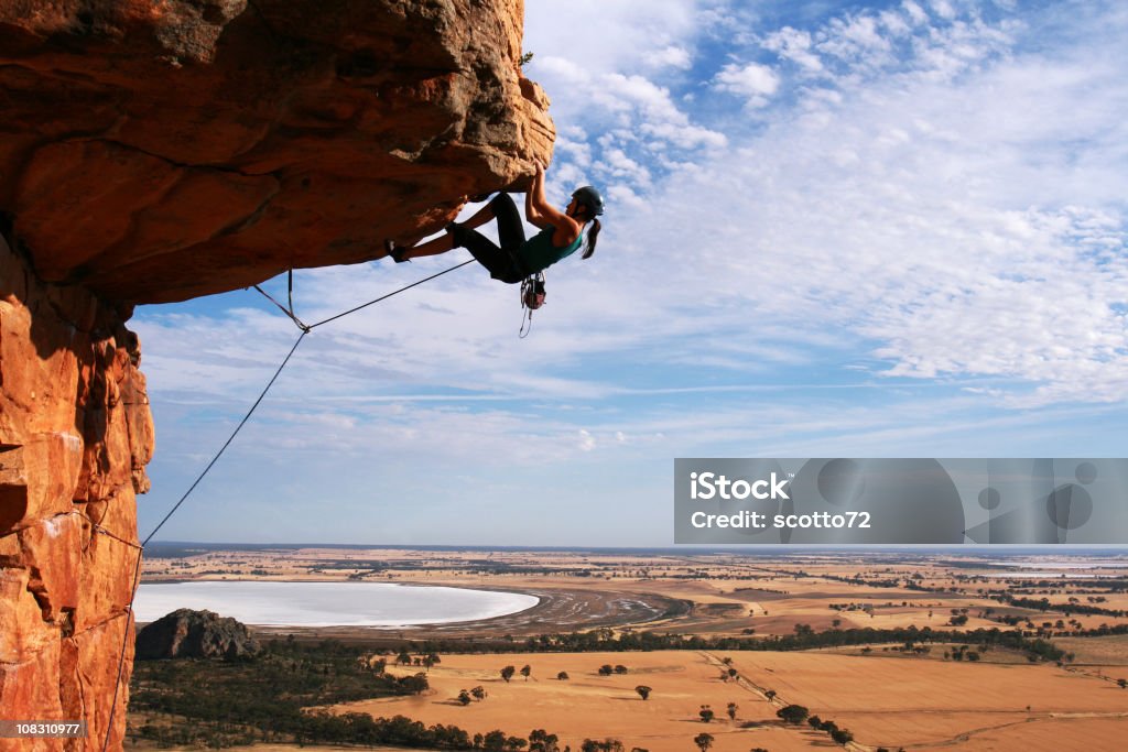 Young woman rock climbing in the desert A woman rock climbing at Mt Arapiles, Victoria, Australia on a sunny day

For more Rock Climbing photos...

[url=http://www.istockphoto.com/my_lightbox_contents.php?lightboxID=1651273][img]http://www.dreamvistas.com/images/rockclimbing_banner.jpg[/img][/url] Rock Climbing Stock Photo