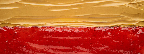 Peanut Butter and Jelly Panoramic photograph of delicious peanut butter and strawberry jelly, together again. peanut butter and jelly sandwich stock pictures, royalty-free photos & images