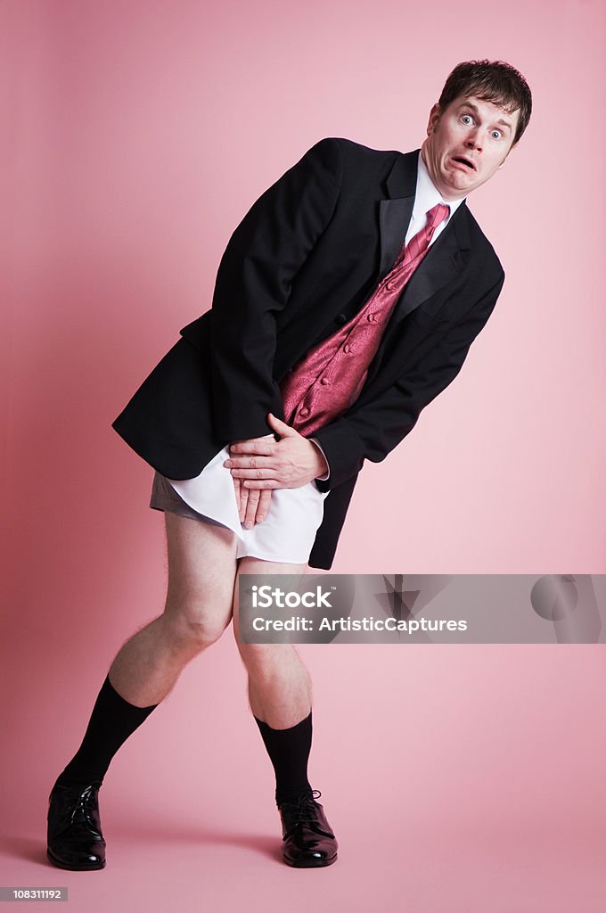 Scioccato uomo in tuta senza pantaloni in - Foto stock royalty-free di Uomini