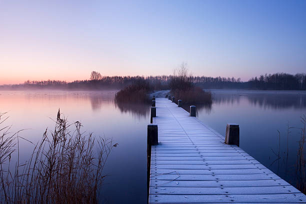istock Boardwalk on a lake at dawn in winter, The Netherlands 108311327