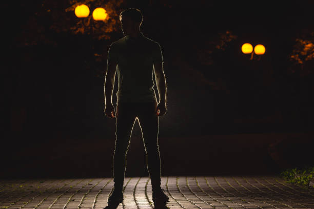 istock The man stand on the street. night time 1083113424
