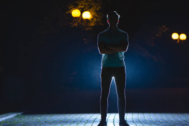 istock The man stand on the street. night time 1083115308