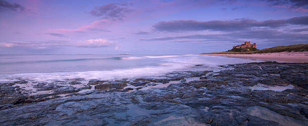 Bamburgh Castle at Sunset  Bamburgh stock pictures, royalty-free photos & images