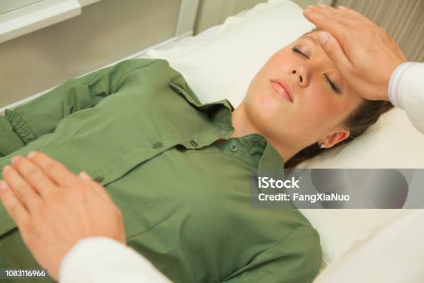 Doctors Hands Hovering Over Patient Stock Photo - Download Image Now - Balance, Healthcare And Medicine, The Human Body
