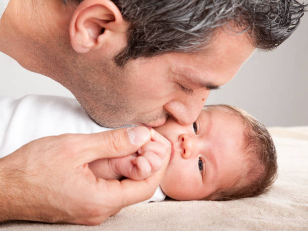 istock Father kissing baby boy 108311710