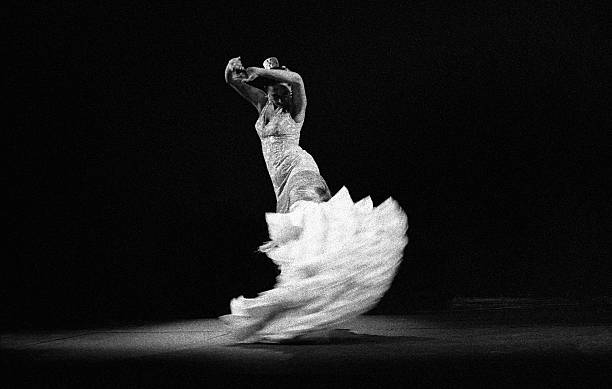 Flamenco dancer in white stock photo