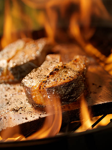 istock Cedar Plank Salmon Steaks on an outdoor BBQ 108311767