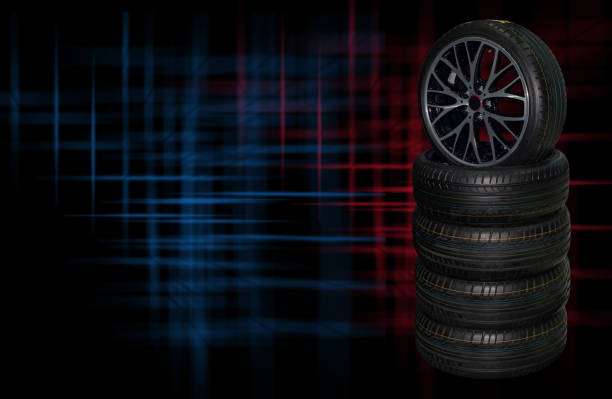 Close up of a mid 20th century English classic sports car, wire spoked wheel with a sparkling chrome finish. Copy space.