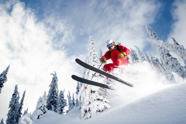 Powder skiing Heli skiing in deep powder. ski resort flash stock pictures, royalty-free photos & images